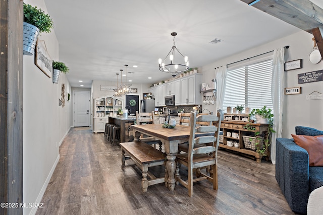 14233 E Hub Dr, Vail, AZ 85641 - dining space featuring a chandelier, dark wood-type flooring, baseboards, and recessed lighting