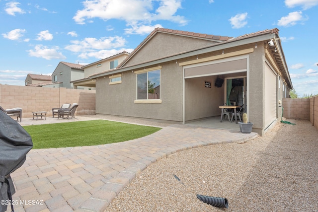 14233 E Hub Dr, Vail, AZ 85641 - back of property featuring a patio, a fenced backyard, and stucco siding