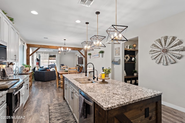 14233 E Hub Dr, Vail, AZ 85641 - kitchen featuring a sink, appliances with stainless steel finishes, wood finished floors, white cabinetry, and recessed lighting