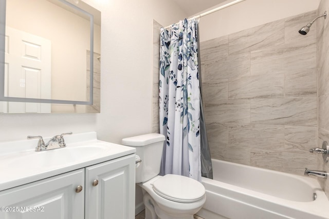 full bath with toilet, shower / bath combo with shower curtain, and vanity