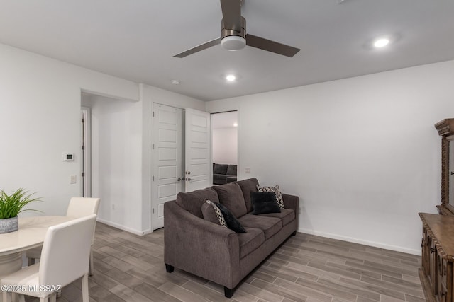 7988 S Bonanza Park Dr, Tucson, AZ 85747 - living area with light wood-type flooring, ceiling fan, baseboards, and recessed lighting