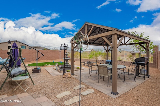 7988 S Bonanza Park Dr, Tucson, AZ 85747 - view of patio featuring a gazebo, a fenced backyard, and a grill