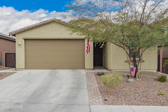 7988 S Bonanza Park Dr, Tucson, AZ 85747 - view of front of home featuring stucco siding, driveway, and a garage