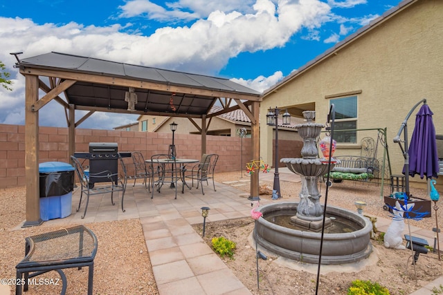 7988 S Bonanza Park Dr, Tucson, AZ 85747 - view of patio featuring a gazebo, fence, and a grill