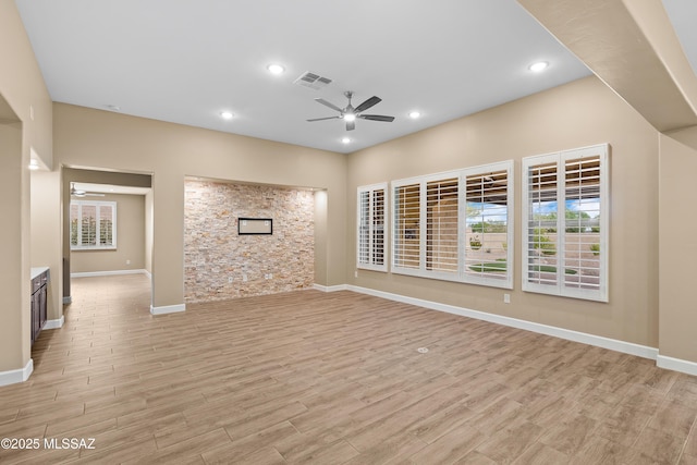 60922 E Arbor Basin Rd, Oracle, AZ 85623 - unfurnished living room featuring a ceiling fan, light wood-style floors, baseboards, and recessed lighting