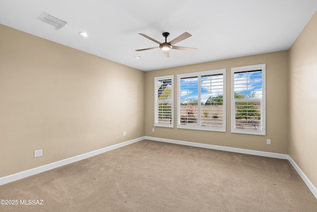 60922 E Arbor Basin Rd, Oracle, AZ 85623 - spare room featuring a ceiling fan, light carpet, baseboards, and recessed lighting