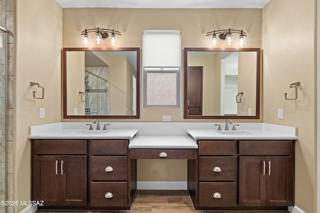 60922 E Arbor Basin Rd, Oracle, AZ 85623 - full bathroom with two vanities, a stall shower, and wood finished floors