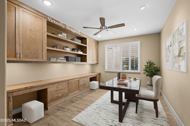 60922 E Arbor Basin Rd, Oracle, AZ 85623 - office space featuring ceiling fan, light wood-type flooring, built in desk, recessed lighting, and baseboards
