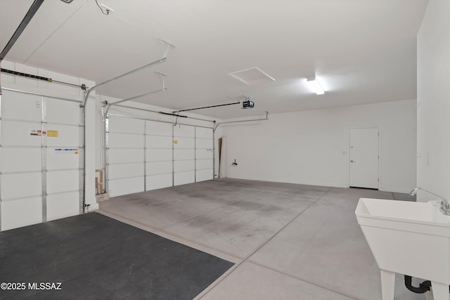 60922 E Arbor Basin Rd, Oracle, AZ 85623 - garage with a sink and a garage door opener