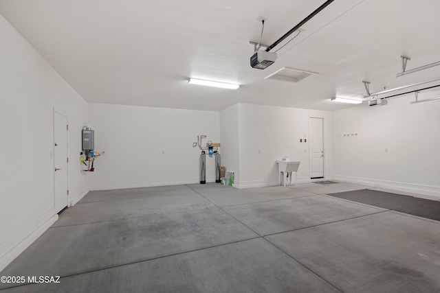 60922 E Arbor Basin Rd, Oracle, AZ 85623 - garage featuring a garage door opener and water heater