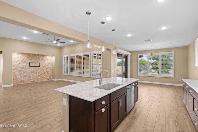 60922 E Arbor Basin Rd, Oracle, AZ 85623 - kitchen with a sink, light wood-style floors, dark brown cabinetry, ceiling fan, and baseboards