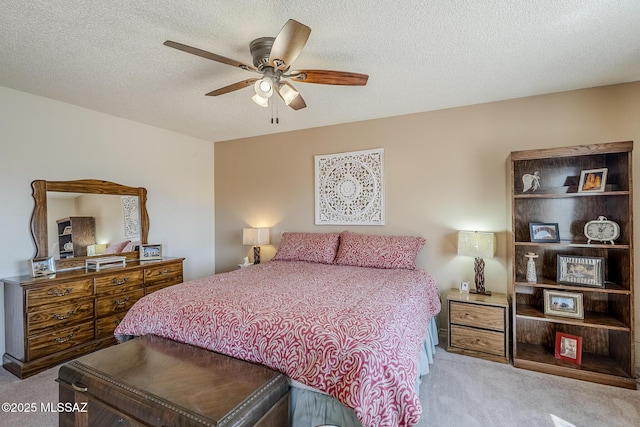 723 S Los Zafiros, Green Valley, AZ 85614 - bedroom featuring carpet flooring, a ceiling fan, and a textured ceiling