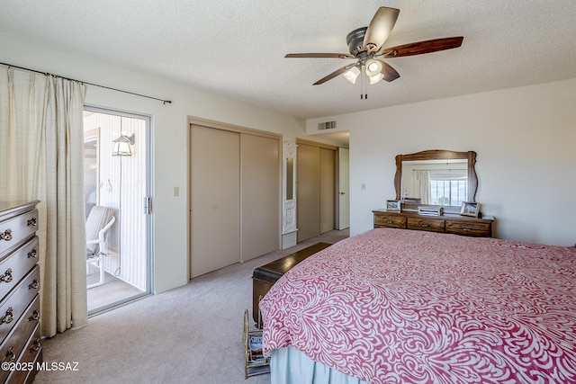 723 S Los Zafiros, Green Valley, AZ 85614 - bedroom featuring carpet floors, a textured ceiling, a closet, and ceiling fan