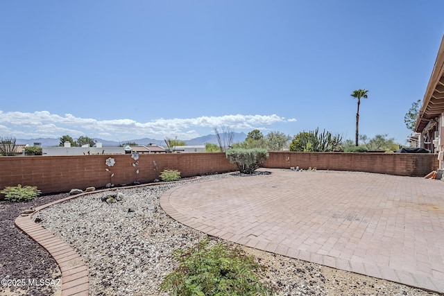 723 S Los Zafiros, Green Valley, AZ 85614 - view of patio with a fenced backyard and a mountain view