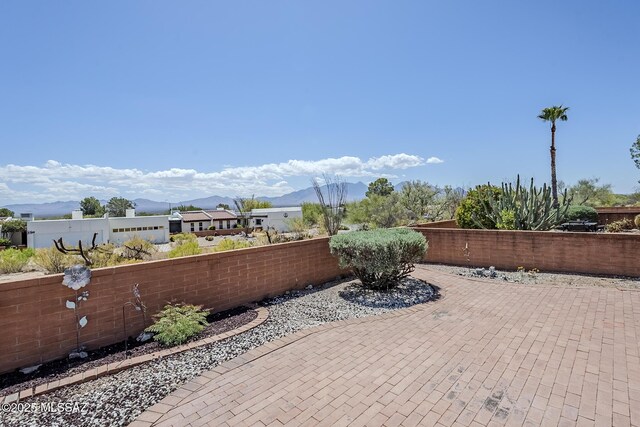 723 S Los Zafiros, Green Valley, AZ 85614 - view of patio featuring a mountain view and a fenced backyard