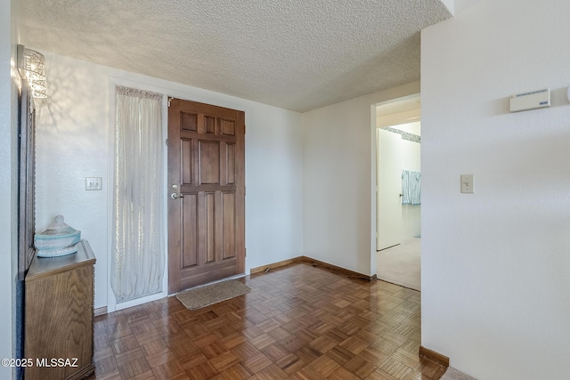 723 S Los Zafiros, Green Valley, AZ 85614 - foyer featuring baseboards and a textured ceiling