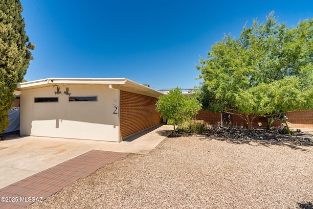 2 S Antietam Pl, Tucson, AZ 85710 - view of side of home featuring brick siding