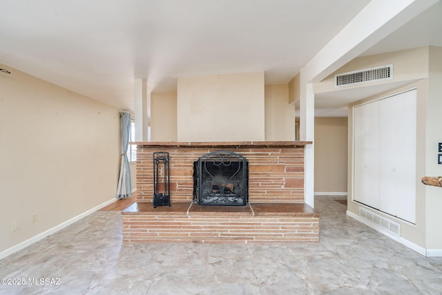 2 S Antietam Pl, Tucson, AZ 85710 - unfurnished living room featuring a brick fireplace and baseboards