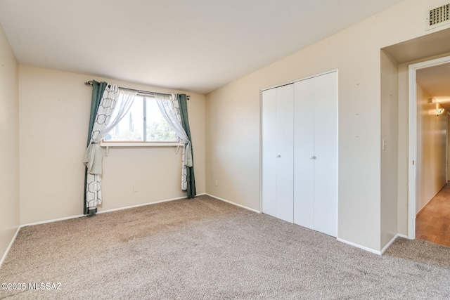 2 S Antietam Pl, Tucson, AZ 85710 - unfurnished bedroom featuring carpet floors, a closet, and baseboards
