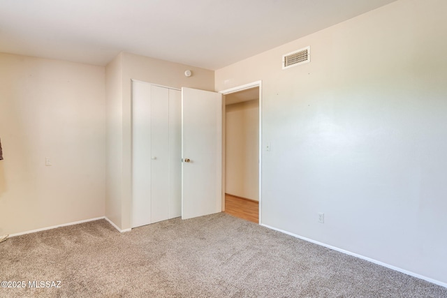 2 S Antietam Pl, Tucson, AZ 85710 - unfurnished bedroom featuring carpet floors, a closet, and baseboards