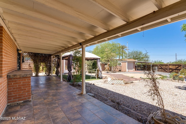2 S Antietam Pl, Tucson, AZ 85710 - fenced backyard with a gazebo and a patio area