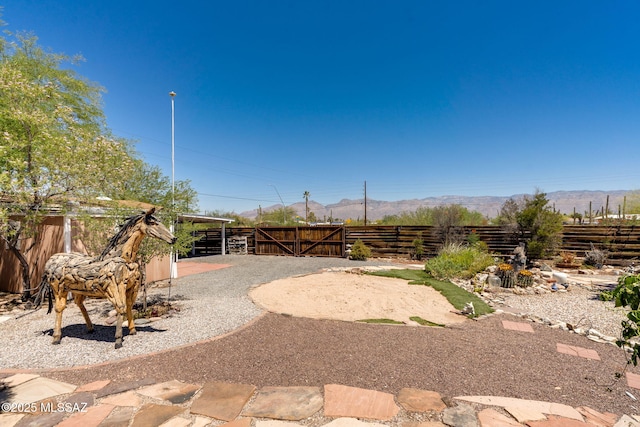 2 S Antietam Pl, Tucson, AZ 85710 - view of yard with a mountain view and a gate