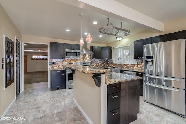 2 S Antietam Pl, Tucson, AZ 85710 - kitchen with appliances with stainless steel finishes, wall chimney range hood, plenty of natural light, light stone counters, and recessed lighting