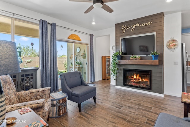 7138 W Ferntree Ln, Tucson, AZ 85757 - living room with a ceiling fan, recessed lighting, a large fireplace, wood finished floors, and plenty of natural light