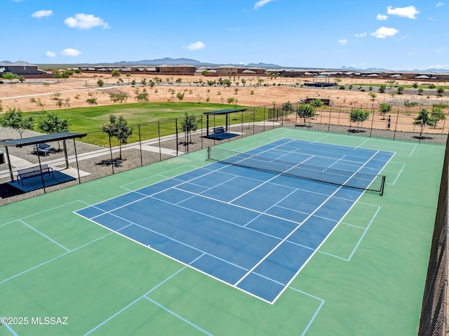 7138 W Ferntree Ln, Tucson, AZ 85757 - view of tennis court featuring fence, a mountain view, and view of desert landscape