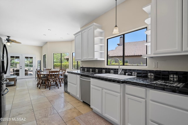 11300 N Scioto Ave, Oro Valley, AZ 85737 - kitchen featuring a sink, stainless steel dishwasher, open shelves, tile counters, and white cabinets