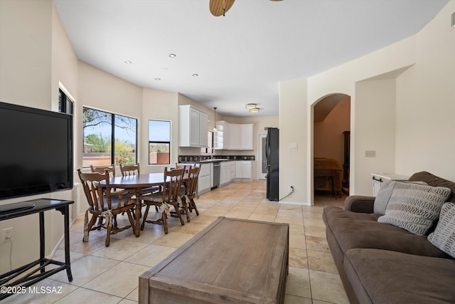 11300 N Scioto Ave, Oro Valley, AZ 85737 - living area with arched walkways, light tile patterned floors, recessed lighting, and baseboards
