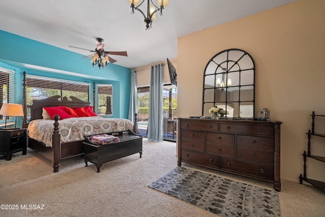 11300 N Scioto Ave, Oro Valley, AZ 85737 - carpeted bedroom featuring access to exterior, a chandelier, and a ceiling fan
