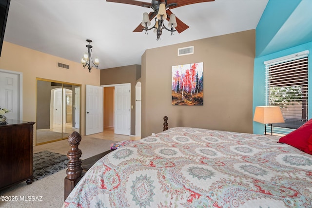 11300 N Scioto Ave, Oro Valley, AZ 85737 - bedroom with arched walkways, carpet floors, baseboards, a closet, and a chandelier