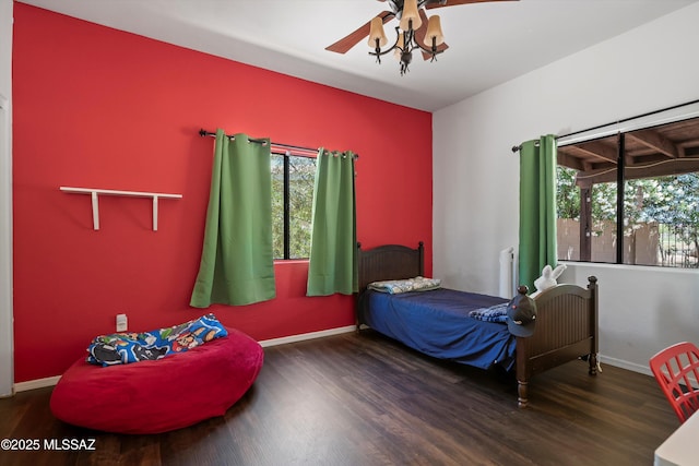 11300 N Scioto Ave, Oro Valley, AZ 85737 - bedroom featuring wood finished floors, baseboards, and a ceiling fan