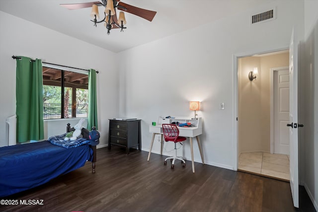 11300 N Scioto Ave, Oro Valley, AZ 85737 - bedroom with wood finished floors, baseboards, radiator, and a ceiling fan