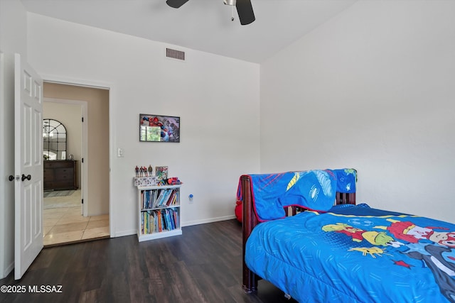 11300 N Scioto Ave, Oro Valley, AZ 85737 - bedroom with wood finished floors, baseboards, and ceiling fan