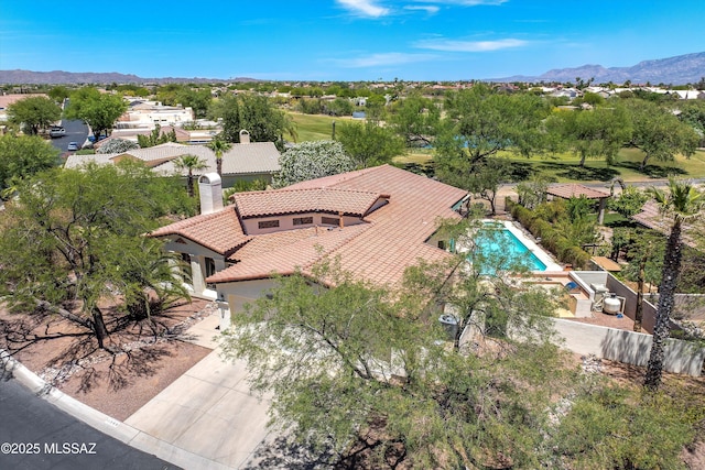 11300 N Scioto Ave, Oro Valley, AZ 85737 - view of subject property with a pool and a mountain backdrop