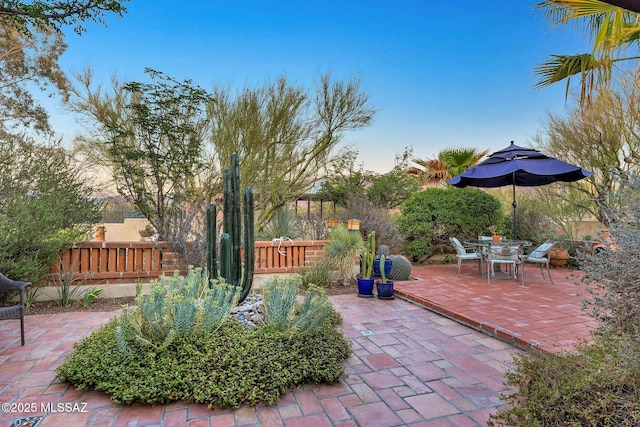 view of patio featuring fence