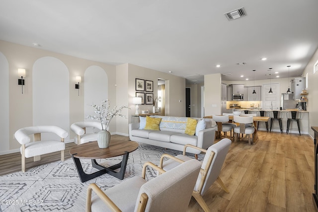 2125 Embarcadero Way, Tubac, AZ 85646 - living room with light wood finished floors, baseboards, and recessed lighting