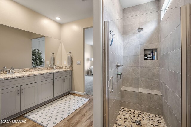 2125 Embarcadero Way, Tubac, AZ 85646 - full bath with tiled shower, double vanity, wood finished floors, and baseboards