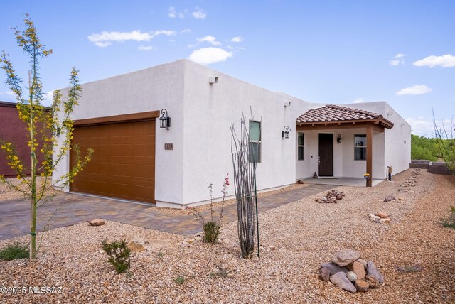2125 Embarcadero Way, Tubac, AZ 85646 - southwest-style home featuring stucco siding, a garage, and a tiled roof