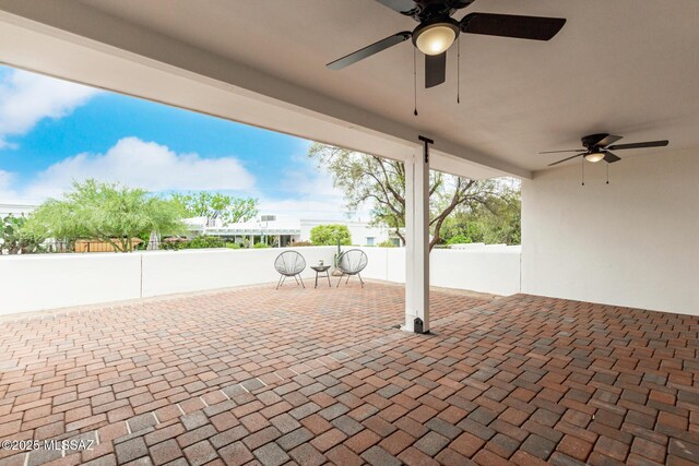 5050 N Crestridge Dr, Tucson, AZ 85718 - view of patio featuring ceiling fan and fence