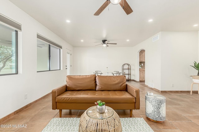 5050 N Crestridge Dr, Tucson, AZ 85718 - living room featuring ceiling fan, arched walkways, recessed lighting, and baseboards
