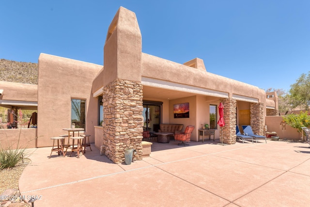 14198 N Gallery Pl, Marana, AZ 85658 - back of property featuring a patio area, stucco siding, and stone siding