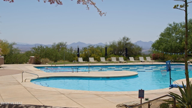 14198 N Gallery Pl, Marana, AZ 85658 - community pool with a mountain view and a patio