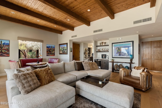 14198 N Gallery Pl, Marana, AZ 85658 - living area featuring bar area, wood finished floors, wooden ceiling with exposed beams, and recessed lighting