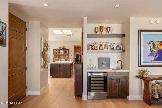 14198 N Gallery Pl, Marana, AZ 85658 - indoor wet bar featuring beverage cooler, light wood-style flooring, baseboards, and recessed lighting