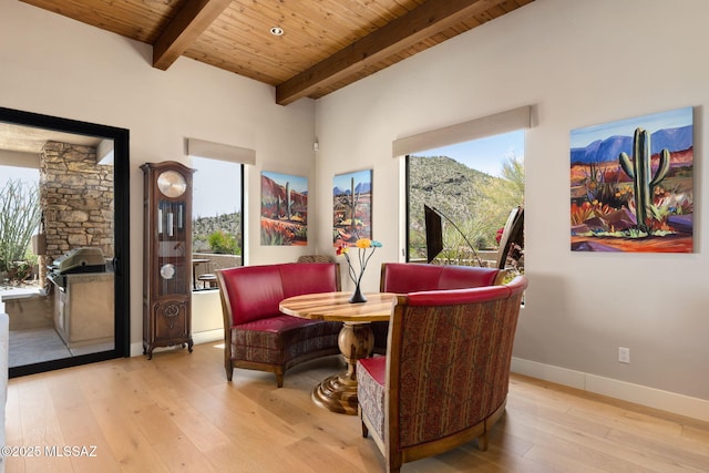 14198 N Gallery Pl, Marana, AZ 85658 - living area with wooden ceiling with exposed beams, healthy amount of natural light, hardwood / wood-style floors, and baseboards