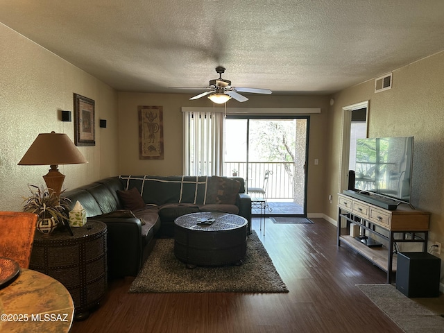 7255 E Snyder Rd # 7203, Tucson, AZ 85750 - living room with a textured wall, wood finished floors, a textured ceiling, a ceiling fan, and baseboards