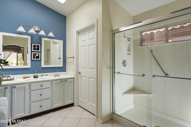2246 E Amaranth St, Oro Valley, AZ 85755 - full bath with a shower stall, tile patterned flooring, and double vanity